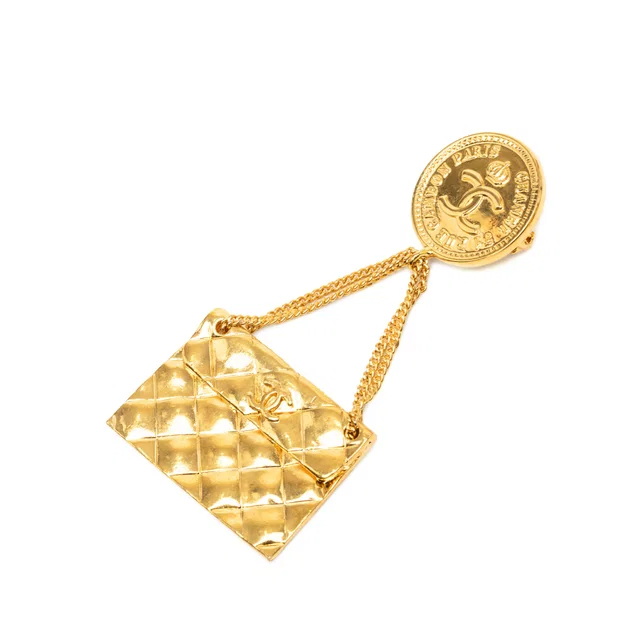 Gold Chanel CC Gold Plated Quilted Flap Bag Medallion Brooch in Gold from Designer Revival