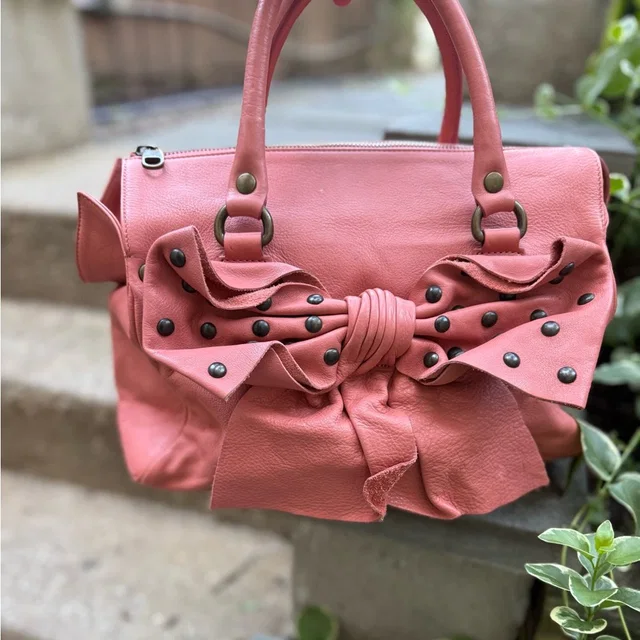 Stunning Pink Leather Red Valentino Pink Satchel With Studs And Bow in pink Leather from Poshmark, photo 1 of 1