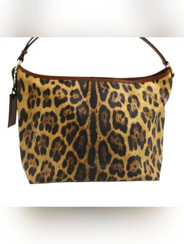 Dolce & Gabbana Dolce & Gabanna Leopard Print Shoulder Hobo Bag In Brown Yellow Pvc in black|brown|red Leather from Poshmark