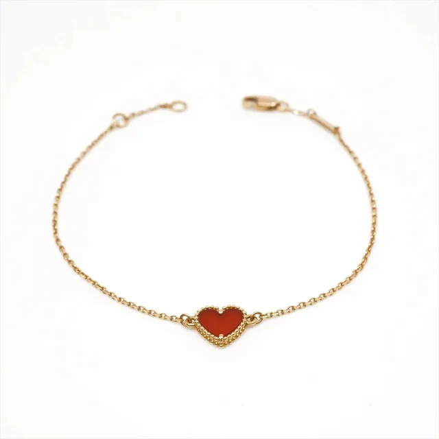 Van Cleef & Arpels Sweet Alhambra Hearts Carnelian Bracelet Pink Gold in Pink from The Purse Affair