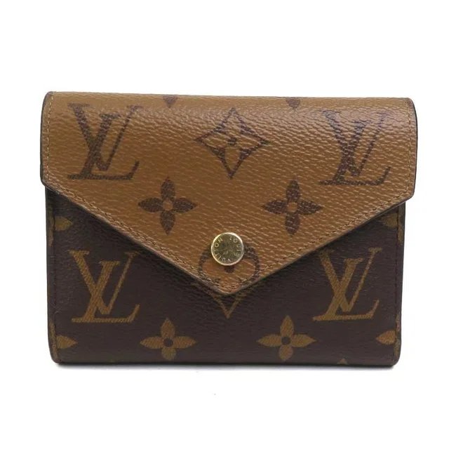 Louis Vuitton Trifold Wallet Monogram Reverse Portefeuille Victorine in Leather from The Reluxe