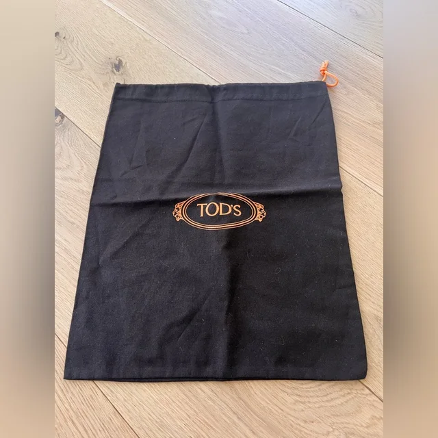 Tod's Black And Orange Logo Dust Bag in orange|black from Poshmark, photo 1 of 1