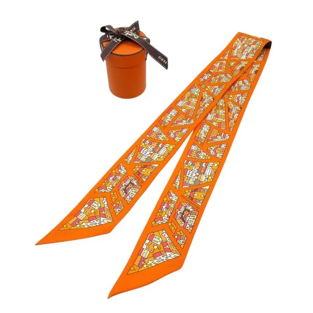 Hermès Twilly Right Bank and Left Scarf Silk Orange Multicolor in Orange Silk from The Reluxe