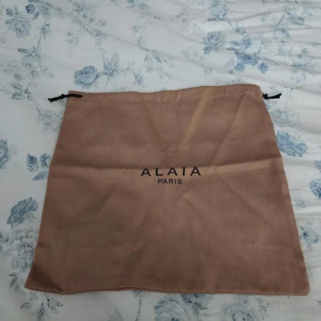 Alaïa Women's Bag - Brown in brown|red from Depop, photo 1 of 1
