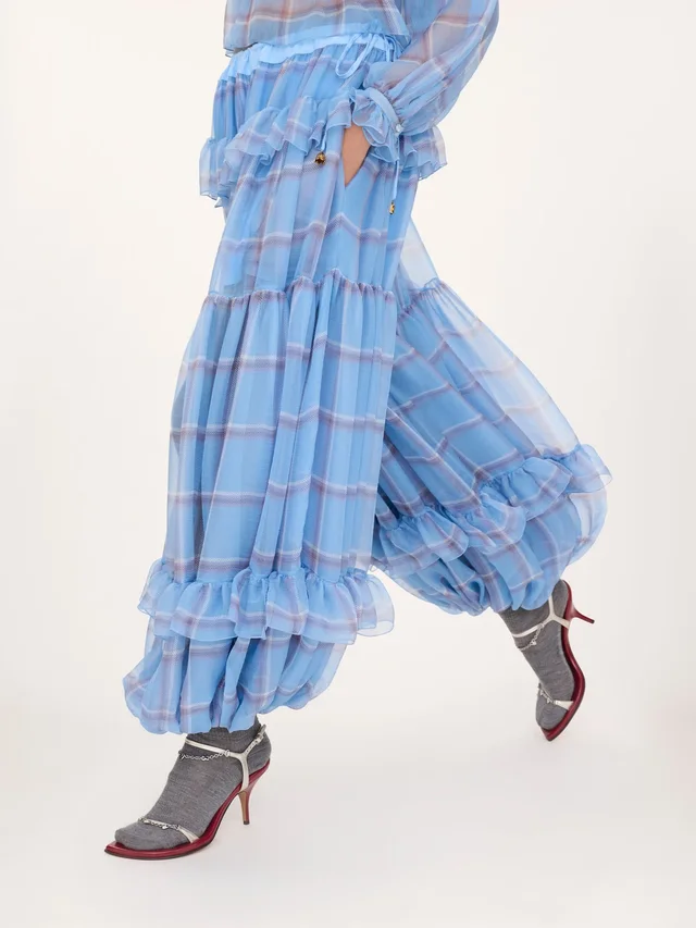 Chloé Ruffled Check Wide-Leg Pants in Silk 100% Description: Fluid pleated trousers in check-print organic silk mousseline with a silk-mix lining, featuring a gathered, tiered…, photo 5 of 7 from SENSER