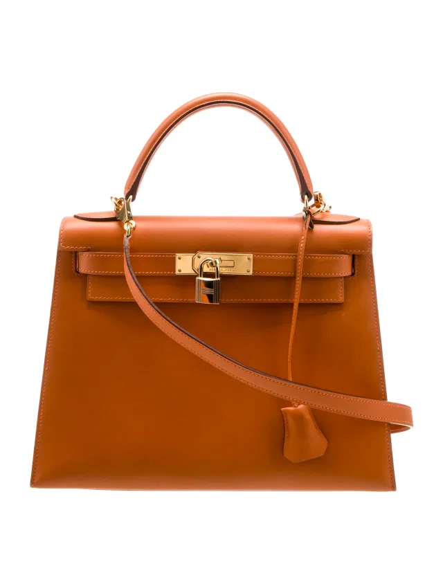 Hermès Kelly Top handle in orange Box leather from The RealReal