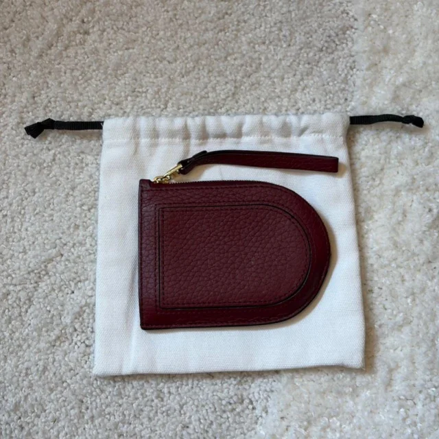 Delvaux Women's Coin purses and pouches - Burgundy in Burgundy from Depop, photo 1 of 1