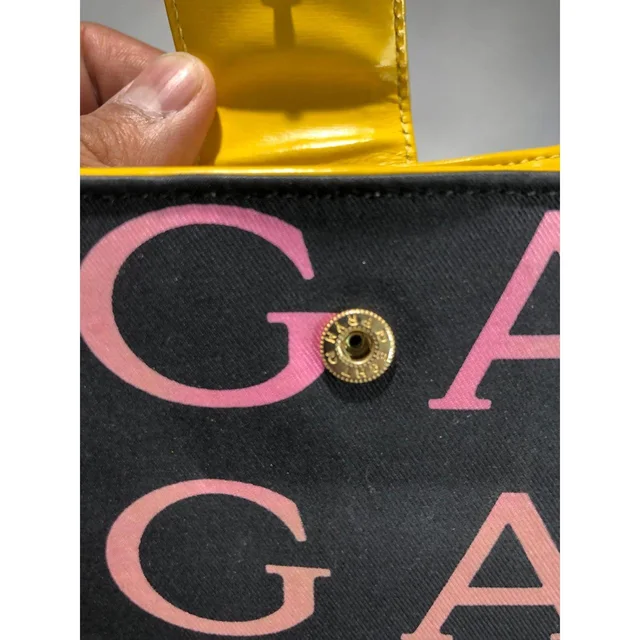 Bvlgari Women's Wallets - Black/Yellow in yellow|black from Depop, photo 4 of 9