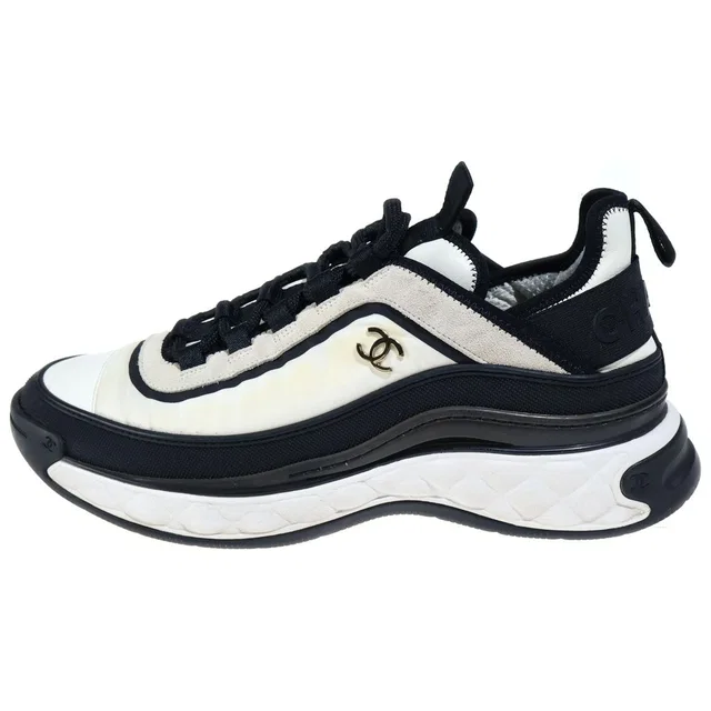 Chanel CC Logo Fabric Low-Top Sneakers White in White from The Reluxe
