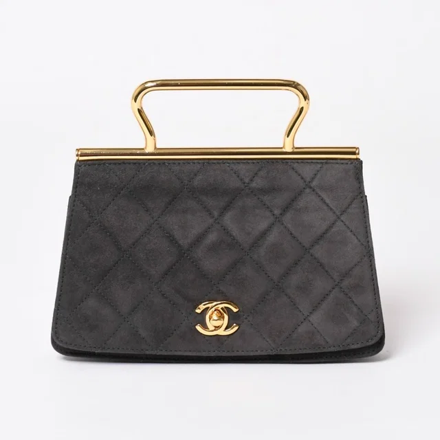 Chanel Top Handle Handbag CC Logo Suede Turnlock Dark Gray Gold in Grey Suede from The Reluxe
