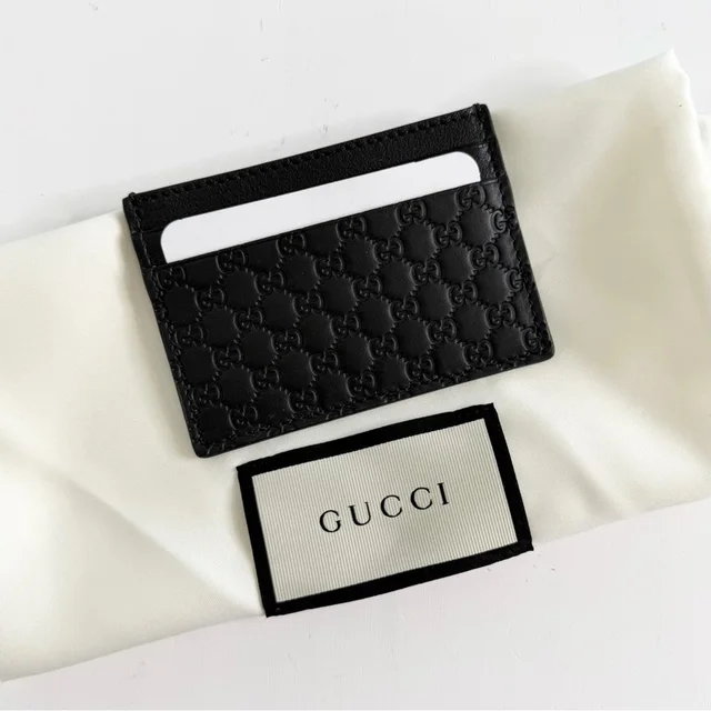 Gucci Gg Guccissima Black Leather Card Holder in black Leather from Poshmark, photo 1 of 1