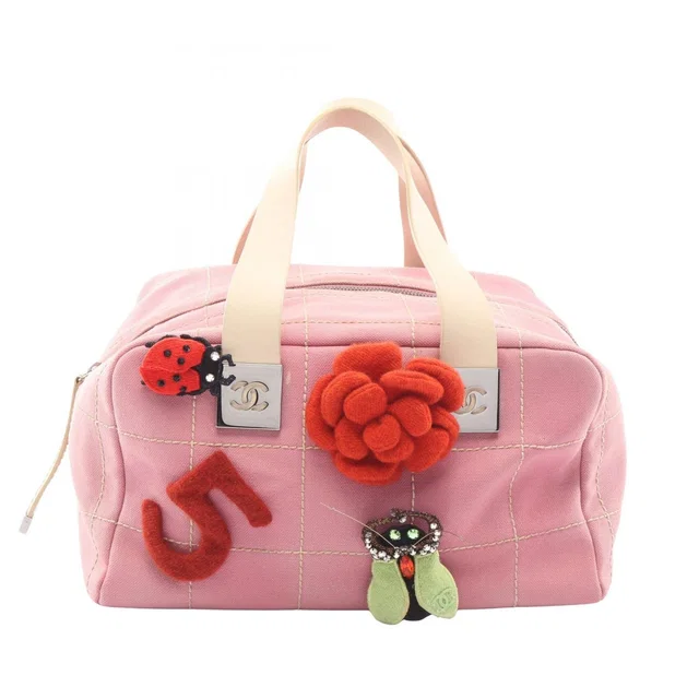 Chanel Choco Bar Camellia Pink Canvas Leather Bar Boston Bag in Pink Canvas from The Reluxe