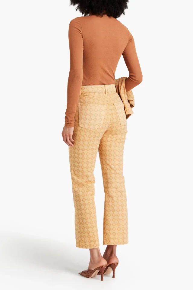 Nanushka Logo-Print High-Rise Kick-Flare Jeans in Sand, photo 3 of 4 from THE OUTNET