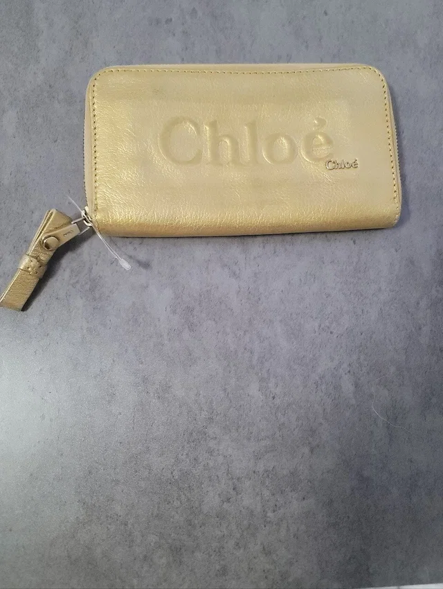 Chloé Zip Wallet in gold from Poshmark