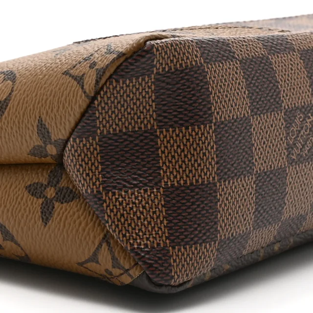Louis Vuitton Reverse Monogram Drip Pochette Voyage Souple in Coated canvas from FASHIONPHILE, photo 7 of 8