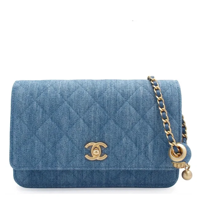 Chanel Quilted Chain Wallet Blue Gold Denim Lambskin Coco Ball Random Shoulder in Blue Lambskin from The Reluxe