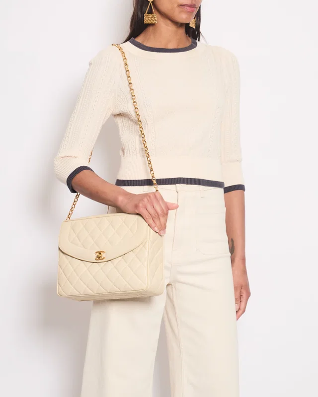 Chanel Cream Knitted Long Sleeve Cardigan With Dark Grey Trim and Gold Buttons Details Size FR 38 (UK… in White from Sellier