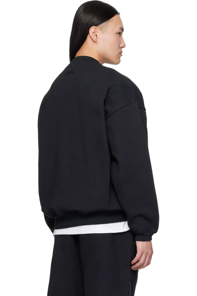 Fear of God ESSENTIALS Black Varsity 90s Crewneck Sweatshirt, photo 3 of 4 from SSENSE