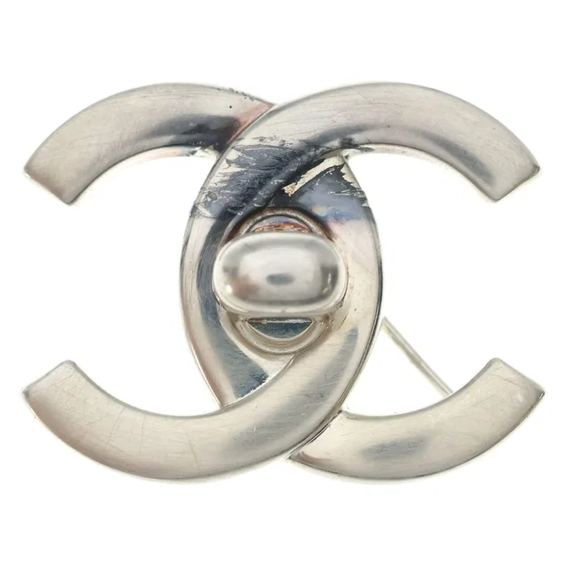 Chanel CC Logo Turnlock Brooch Silver Metal in Silver from The Reluxe