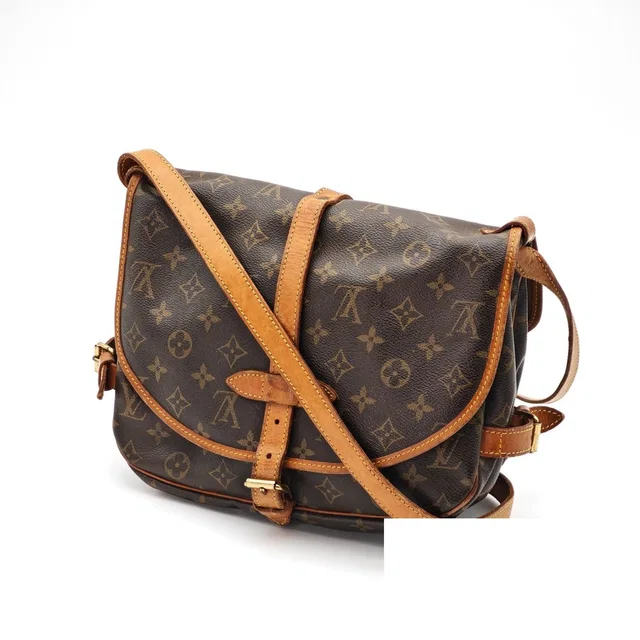 Louis Vuitton Saumur 30 Shoulder Bag Flap Brown in Brown Coated canvas from The Reluxe
