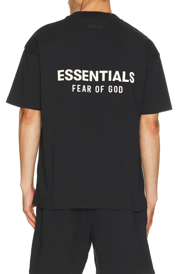 Fear of God ESSENTIALS Classic Fit T-Shirt Back Logo in Vintage Black, photo 2 of 4 from REVOLVE (Canada)
