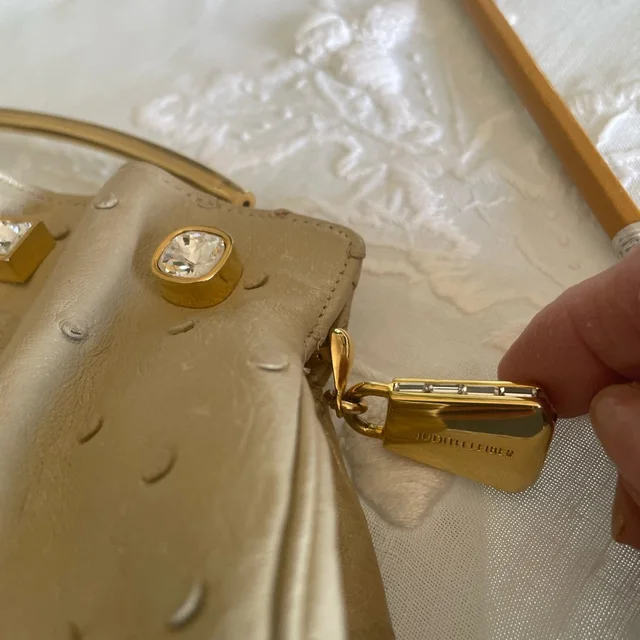 Judith Leiber Clutch With Crystal Accents 11”L 4” H 2” W in gold Ostrich from Poshmark, photo 2 of 6