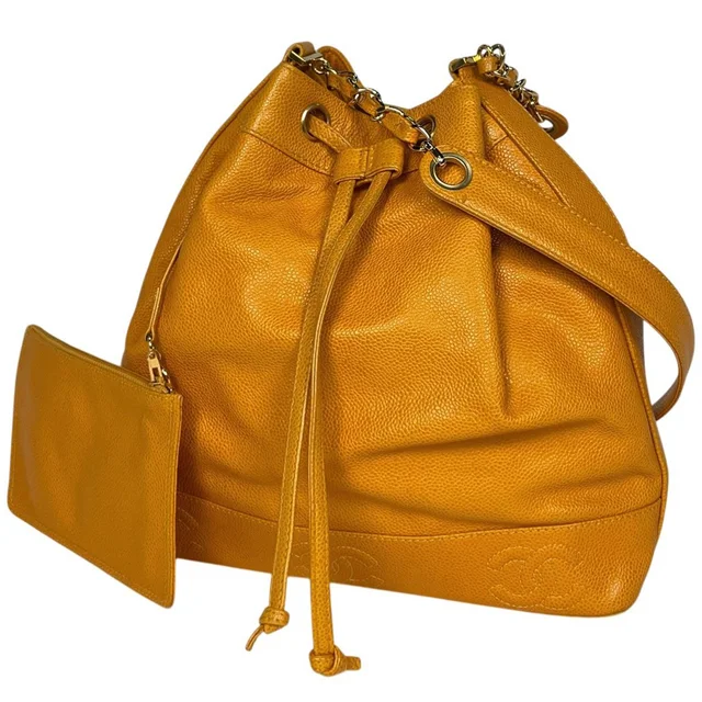 Chanel Shoulder Bag Triple CC Logo Drawstring Caviar Leather Yellow in Yellow Caviar leather from The Reluxe
