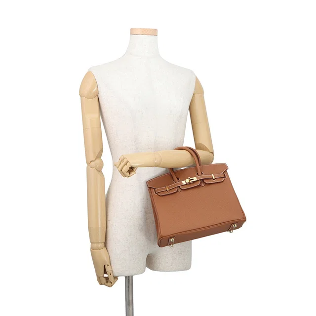 Hermès Birkin Gold Togo Leather Size 25 in Gold Togo leather from GALLERY RARE
