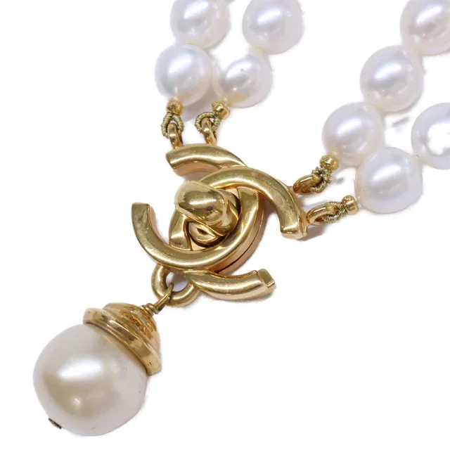 Chanel 96A CC Logo Turnlock Baroque Pearl from The Reluxe