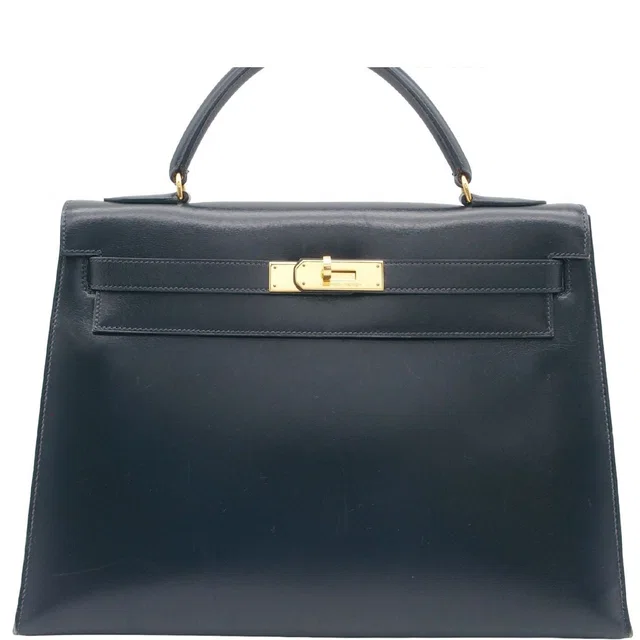Hermès Kelly 32 Handbag in Box leather from The Reluxe
