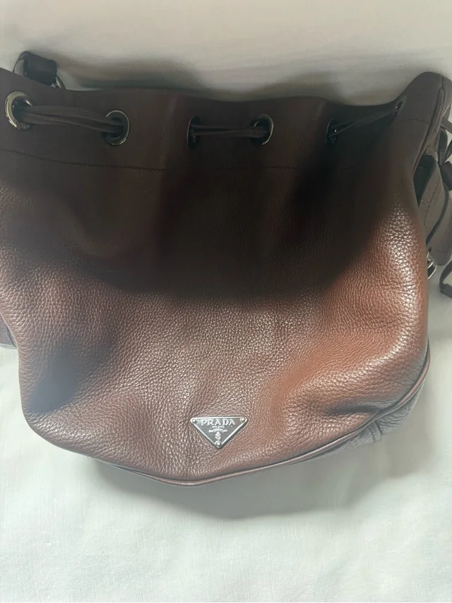 Prada Brown Pebbled Leather Bucket Bag in silver|gray|brown|red Leather from Poshmark
