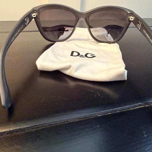 Dolce & Gabbana Women's Cat eye Sunglasses - Black/Brown in black|red|brown from Depop, photo 6 of 6