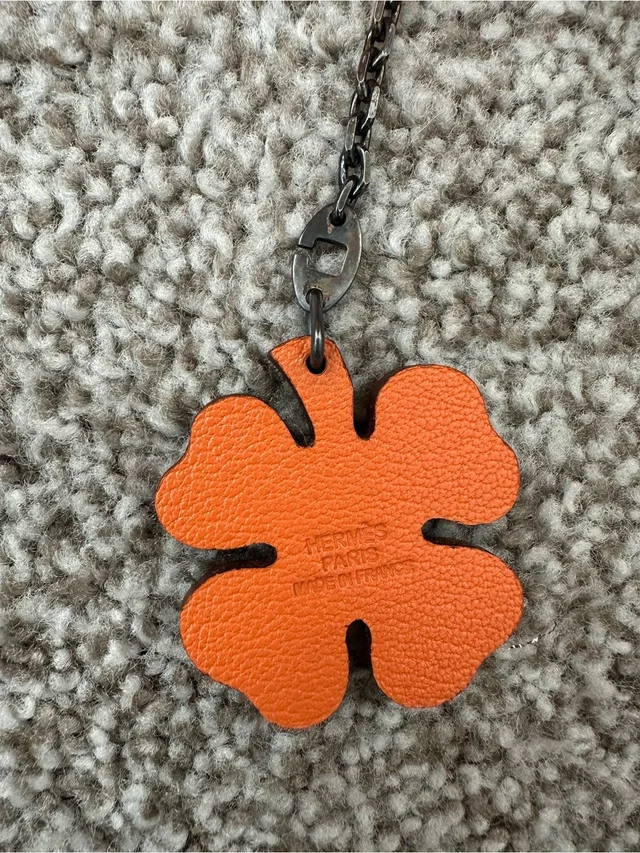 Hermès Orange Leather Clover Pendant Charm. Authentic in orange|brown|red Leather from Poshmark, photo 4 of 7