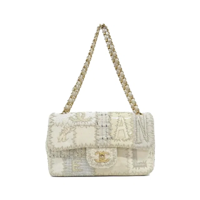 Chanel Shoulder Bag Ivory in White Canvas from The Reluxe