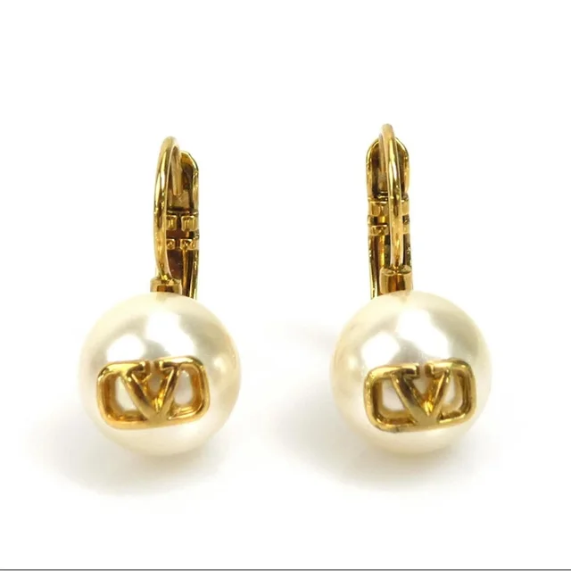 Valentino Garavani Vlogo Pearl Earrings in gold from Poshmark