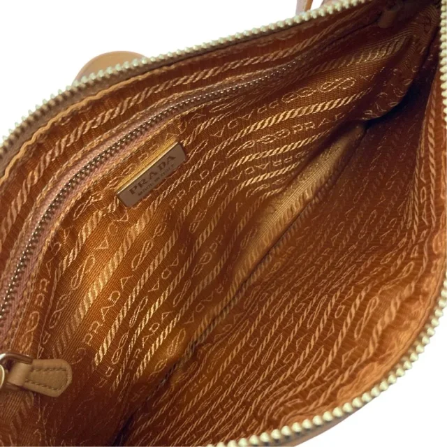 Prada Triangle Plate Soft Grain Leather Shoulder Bag in Brown Leather from LuxUness, photo 12 of 16