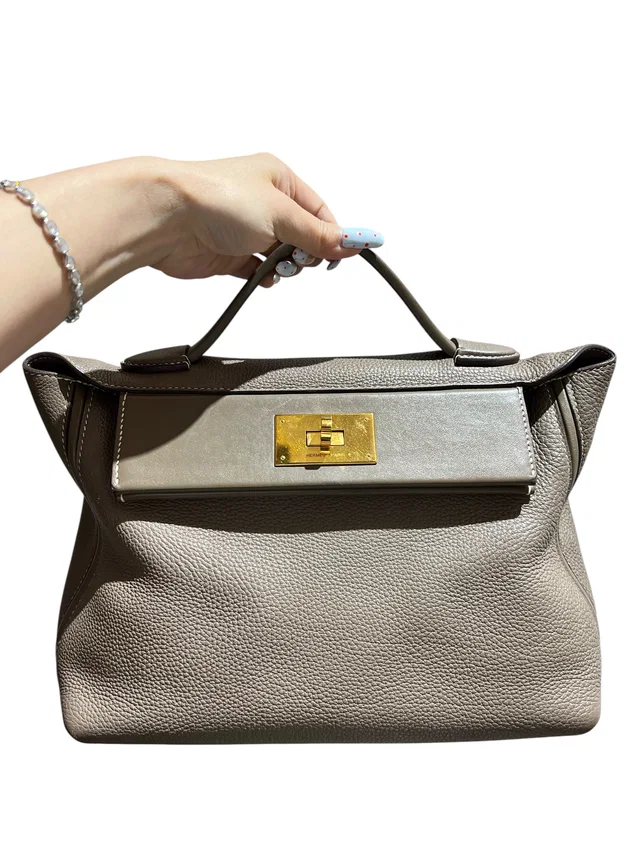 Hermès 24/ Etoupe Togo+Swift Handbag in Taupe Togo leather from Luxury Promise