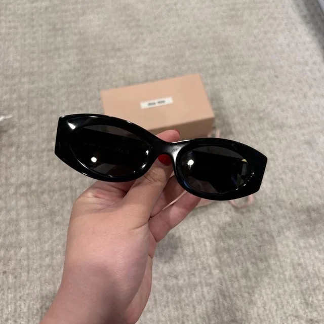Miu Miu Women's Sunglasses - Black in black from Depop, photo 1 of 1