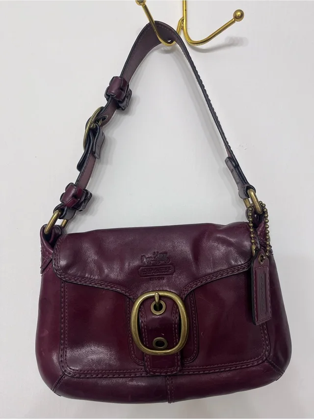 2000s Coach Burgundy Leather Shoulder Bag With Brass Buckle in red Leather from Poshmark, photo 1 of 1