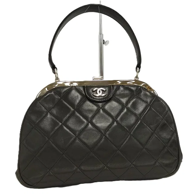 Chanel Vintage Quilted Kiss Lock Handbag One Handle in Leather from The Reluxe