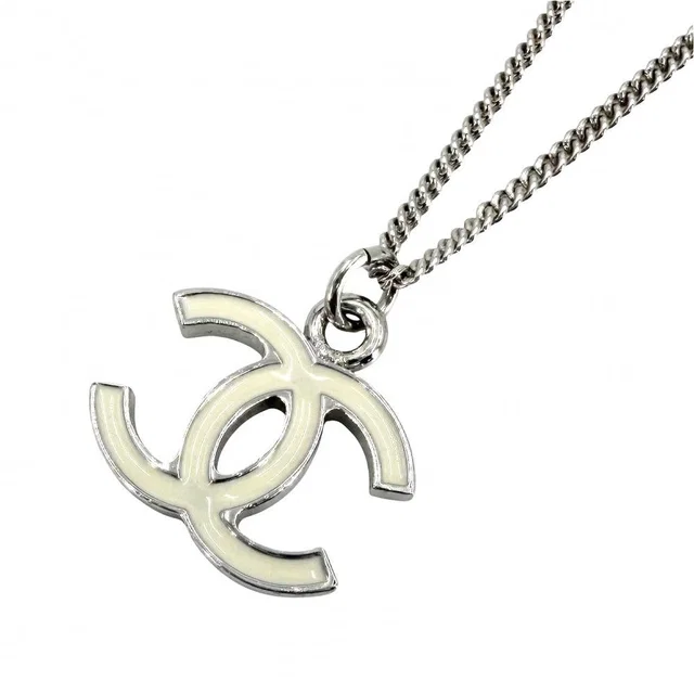 Chanel Necklace CC Logo Silver White in White from The Reluxe