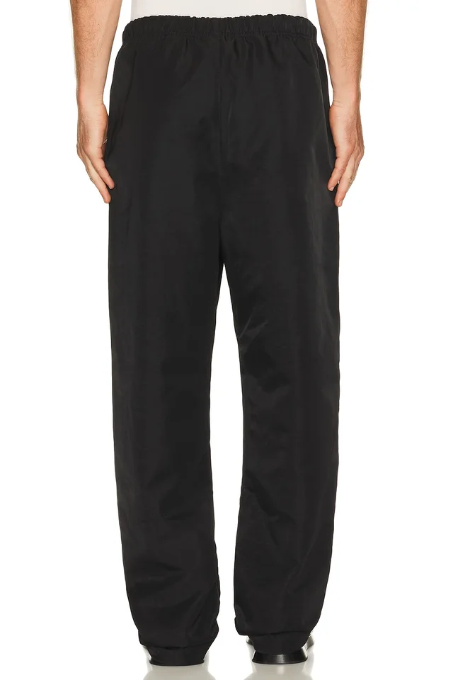 Fear of God ESSENTIALS Active Trace Relaxed Drawstring Pant in Vintage Black, photo 4 of 7 from REVOLVE (Canada)