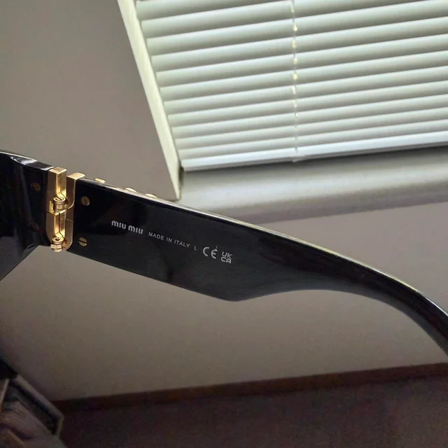 Miu Miu Women's Sunglasses - Black in black from Depop, photo 6 of 8