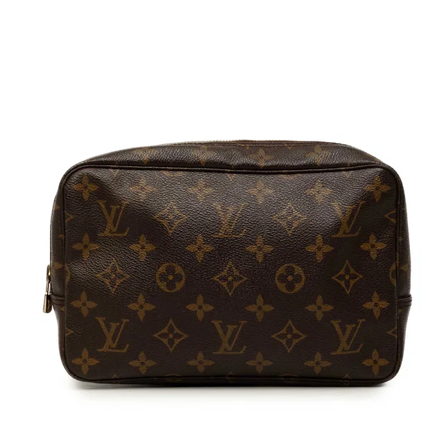 Brown Louis Vuitton Monogram Trousse Toilette 23 Clutch Bag in Brown Coated canvas from Designer Revival, photo 1 of 1
