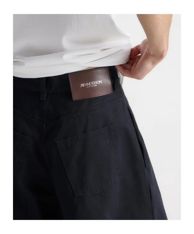 J.W.Anderson Mens single pleat trousers in black, image 1 of 1 from SENSER