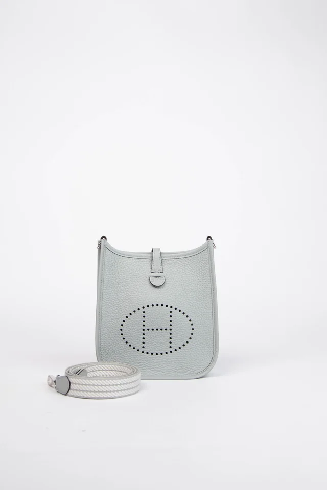 2024 Hermès Blue Glacier Clemence Leather Mini Evelyne with SHW in Blue Clemence leather from Break Archive