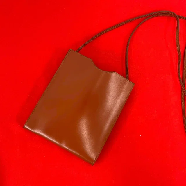 Hermès Omenitu Vintage Leather Shoulder Bag Mini Pochette Crossbody Brown in Brown Leather from The Reluxe
