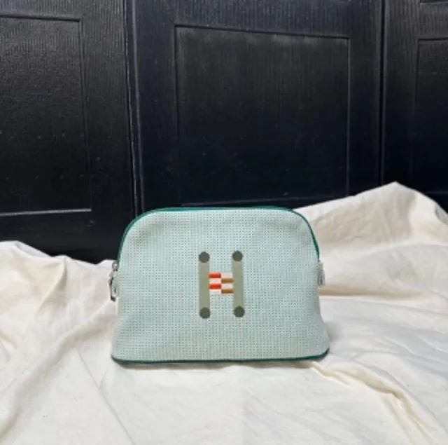 Hermès H canvas toiletry bag in Canvas from Luxury Promise