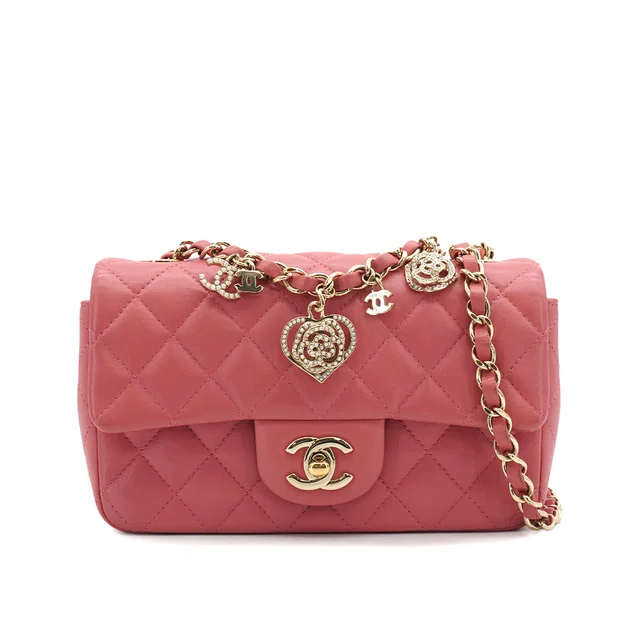 Chanel Mini Matelasse Charm Chain Shoulder Bag Pink Lamb Skin Gold Hardware in Pink Leather from Luxury Promise