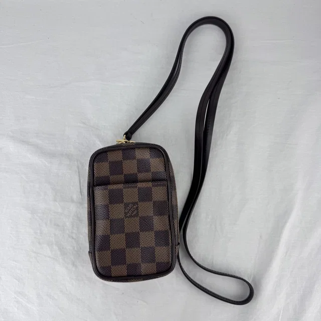 Louis Vuitton Damier Ebene Etui Okapi PM Bag in Brown Canvas, coated canvas, Leather, Metal from Reowned